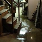 Water flooding across basement floor.